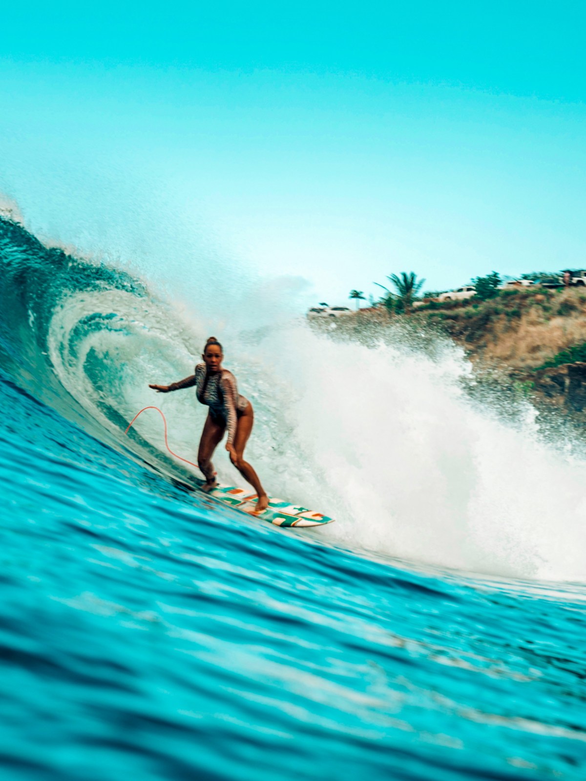 a man riding a wave on a surfboard in the water